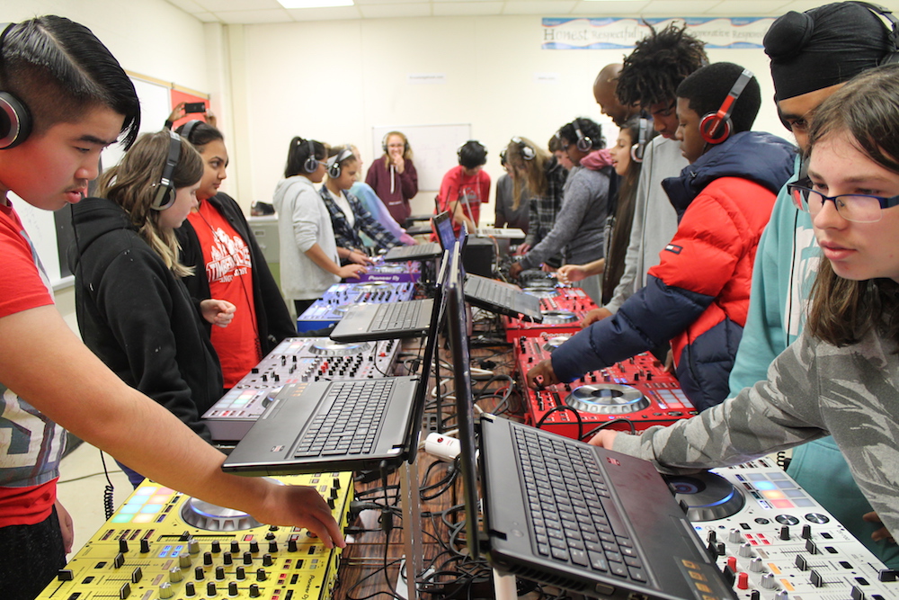 Students learn integers, percentages, decimals, division, multiplication from a DJ console.